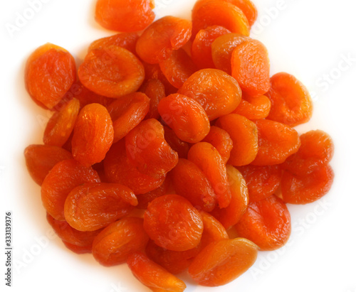 Bunch of dried apricots isolated on white background. Top view.