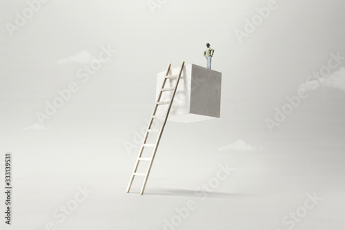 man on the top of a suspended cube observing the future, surreal concept photo