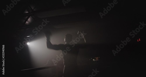 Silhouette of boxer celebrating after winning fight