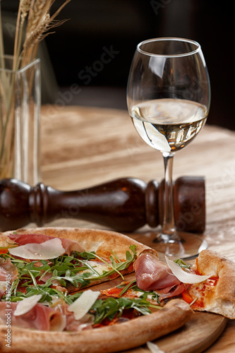 pizza with jamon and herbs