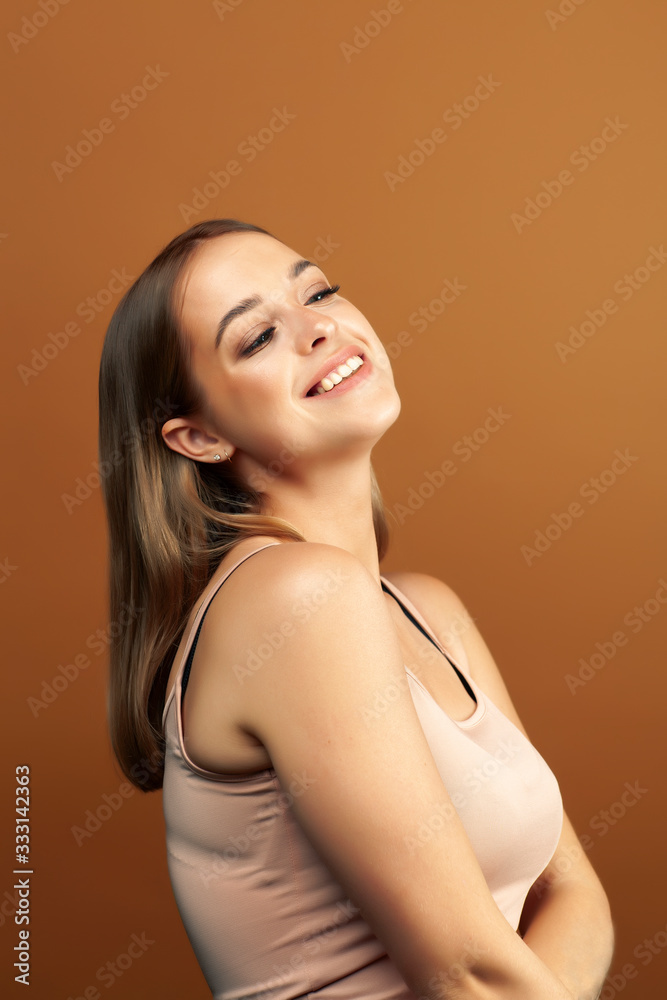 young pretty blond woman with fresh natural makeup posing cheerful on browm background, lifestyle people concept young pretty blond woman with fresh natural makeup posing cheerful on browm background, lifestyle people concept