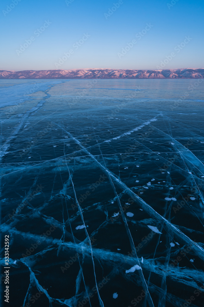 Ice crack in frozen Baikal lake in winter season, Siberia, Russia