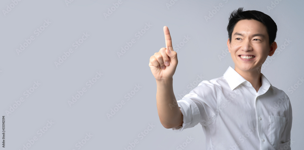 attractive asian male hand gesture present show copy space for your ideas,happiness smile posotive asian male hand point control space in the air white background attractive asian male hand gesture present show copy space for your ideas,happiness smile posotive asian male hand point control space in the air white background
