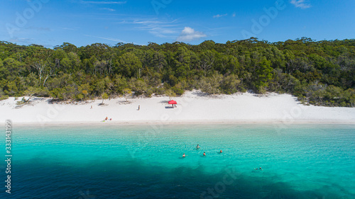 Fototapeta Naklejka Na Ścianę i Meble -  Fraser Island, Queensland / Australia: March 2020: Tourists flock to Lake Mackenzie year round to enjoy the cool freshwater lake