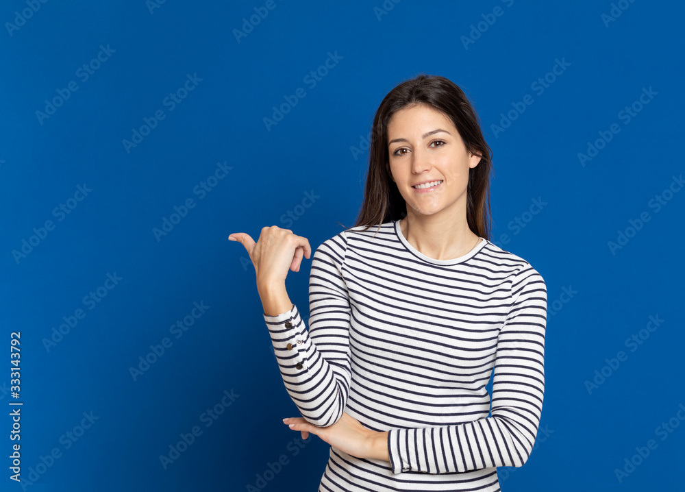 Brunette young woman wearing a striped T-shirt Brunette young woman wearing a striped T-shirt