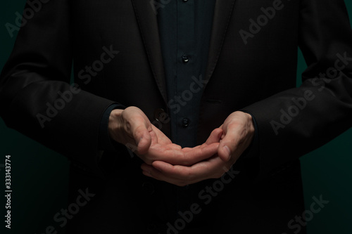 Man holding an invisible object on palm