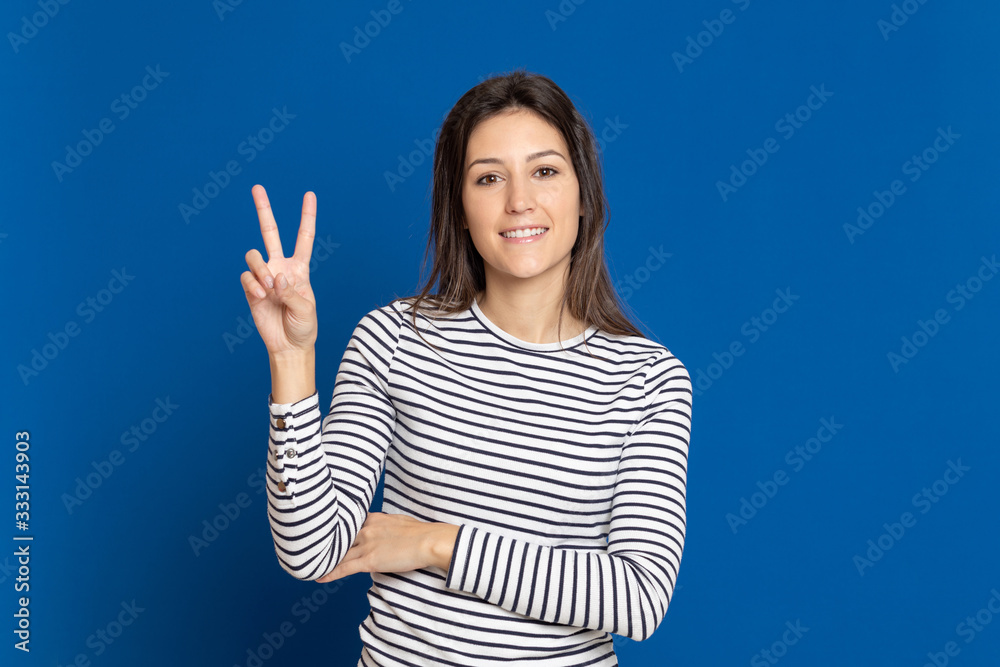 Attractive young girl wearing a striped T-shirt Attractive young girl wearing a striped T-shirt