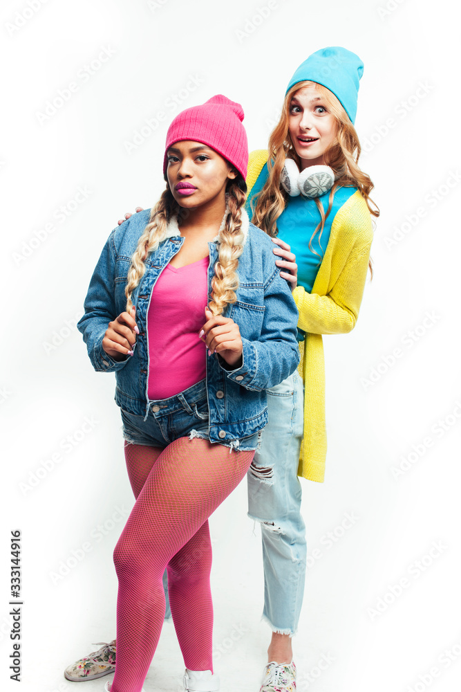 Fototapeta premium teenage girl friends cheerful having fun cute posing isolated on white background, lifestyle mixed races people concept, african and caucasian