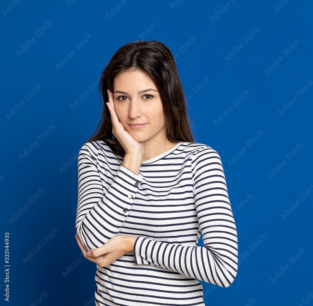 Brunette young woman wearing a striped T-shirt Brunette young woman wearing a striped T-shirt