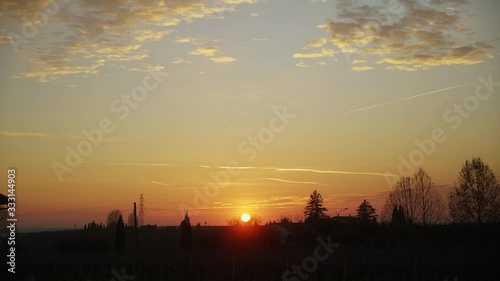 Sun is setting among the hills of the countryside