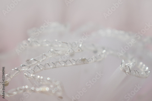 Sofia, Bulgaria - March 24, 2020. White pink lace pattern. Blurry wedding texture. White veil.