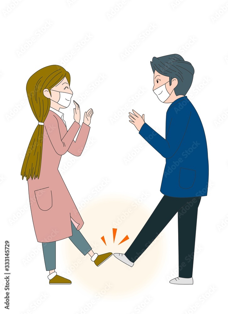 Wearing a mask to prevent the epidemic People greeting with a foot touch. Wearing a mask to prevent the epidemic People greeting with a foot touch.