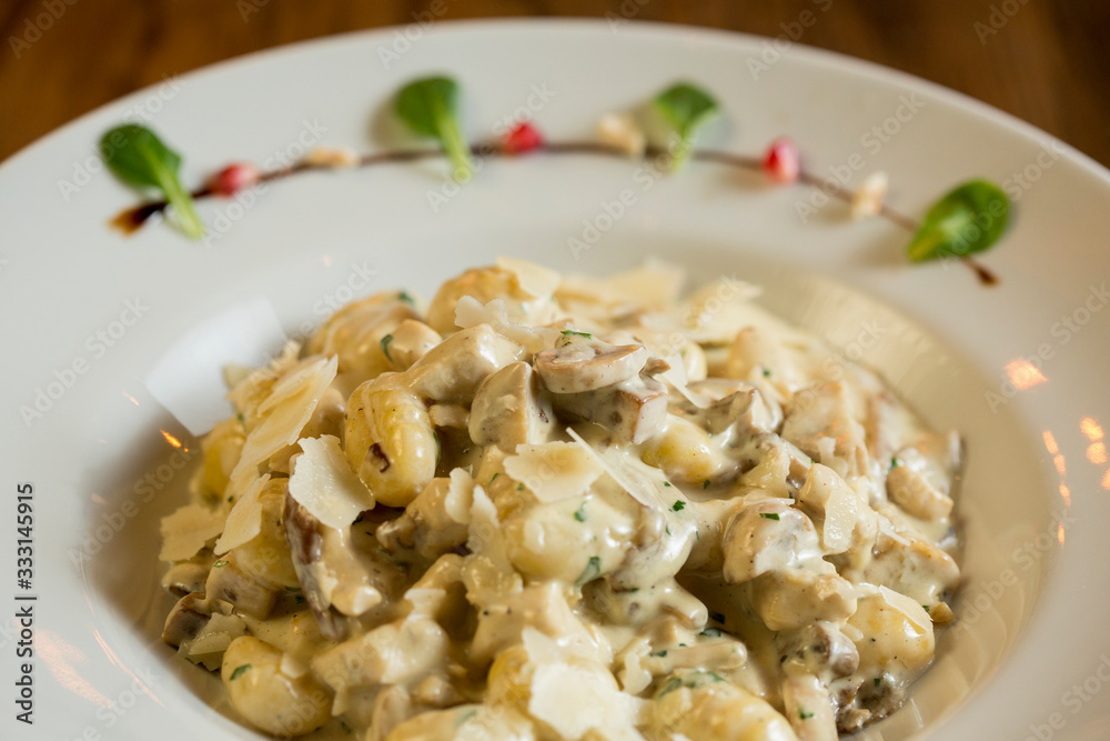 Gnocchi with turkey meat and porcini mushrooms in a cream sauce Gnocchi with turkey meat and porcini mushrooms in a cream sauce