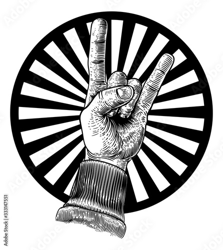 A hand doing a heavy metal rock music sign gesture in a vintage woodcut retro style