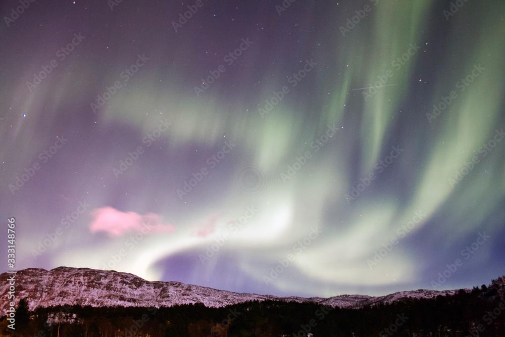 Northern Lights with purple Color and clouds in Norway - Landscape Photography