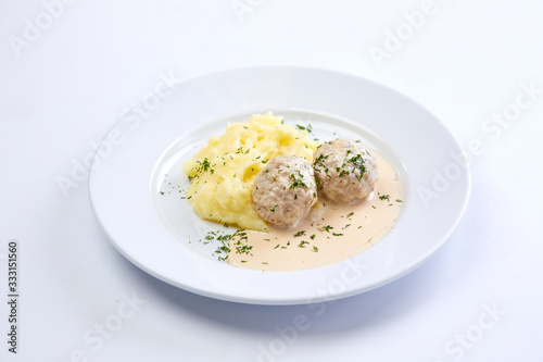 meatballs with mashed potato on the white plate