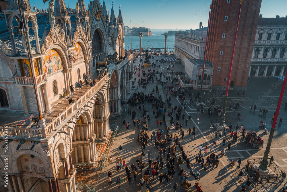 VENICE, VENETO / ITALY - DECEMBER 26 2019: Venice. San Marco square before COVID-19 pandemic VENICE, VENETO / ITALY - DECEMBER 26 2019: Venice. San Marco square before COVID-19 pandemic