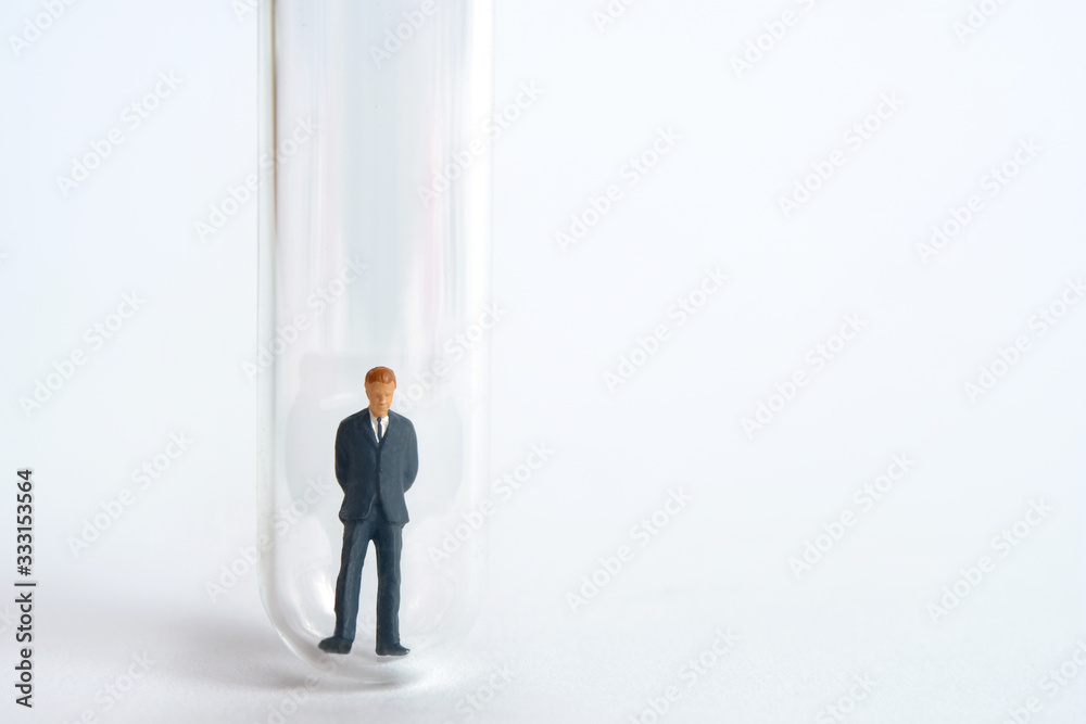 Health conceptual miniature people photography – testing specimen, a volunteer on a laboratory test tube to find a corona virus vaccine Health conceptual miniature people photography – testing specimen, a volunteer on a laboratory test tube to find a corona virus vaccine