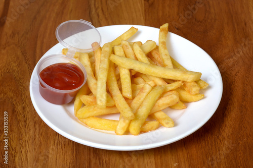 french fries with ketchup on plate