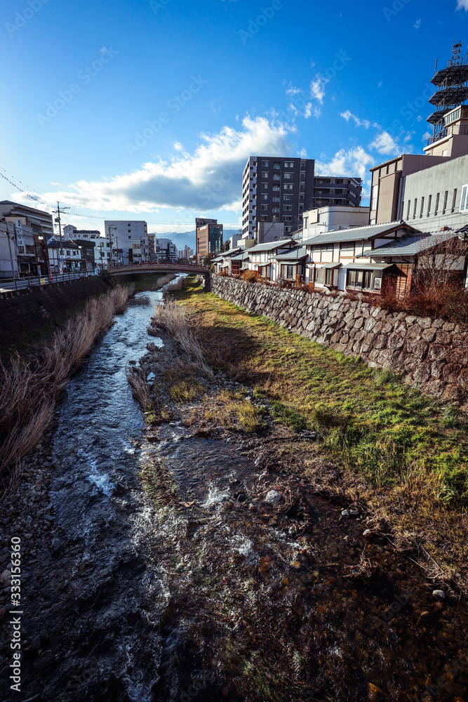 Matsumoto, Japan - January 03, 2020: City View to the River and Buildings