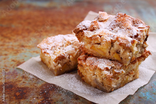 Charlotte apple pie sliced  decorated with powdered sugar