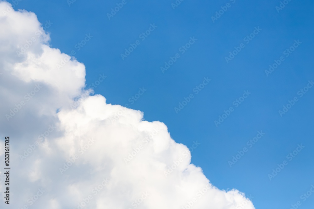 Beautiful white big soft fluffy cloud on a blue sky background Beautiful white big soft fluffy cloud on a blue sky background