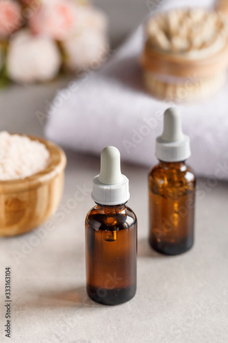 Brown dropper bottles on a blurry background. Beauty concept. Natural oils. Spa items.