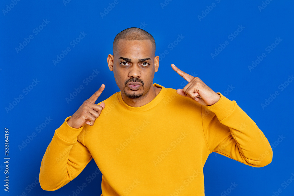 African guy with yellow jersey - obrazy, fototapety, plakaty 