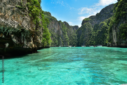 Breathtaking landscape in Koh Phi Phi with clear water and high limestone cliffs in great weather © David
