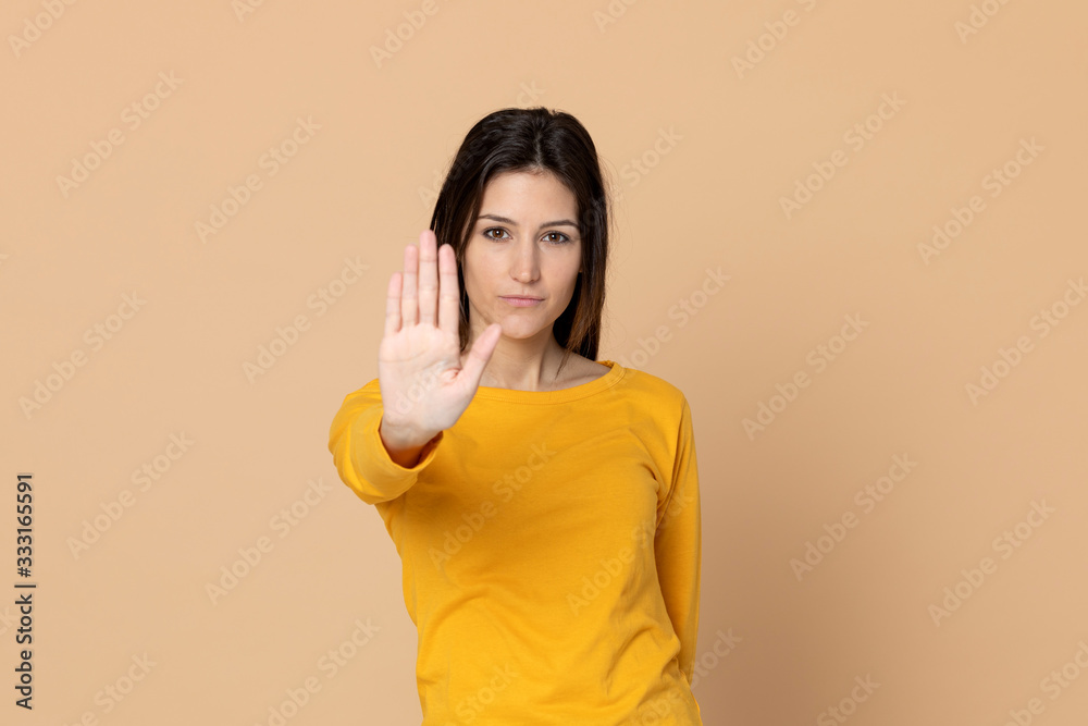 Attractive young girl wearing a yellow T-shirt Attractive young girl wearing a yellow T-shirt