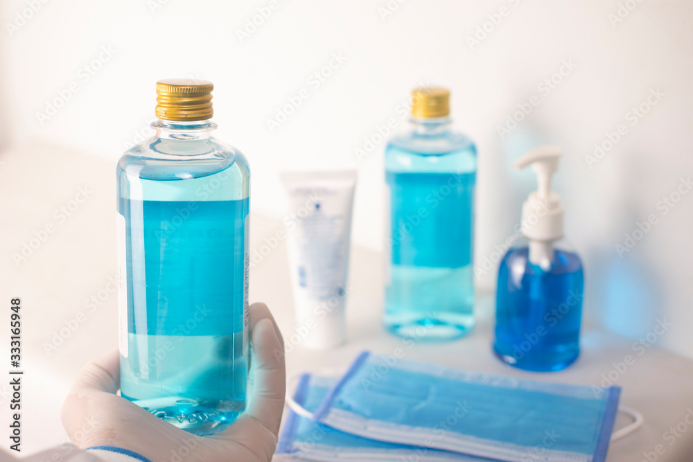 Alcohol sanitizer in the hand of the doctor use for sterile and prevent germs,Coronavirus,Covid-19. Alcohol sanitizer in the hand of the doctor use for sterile and prevent germs,Coronavirus,Covid-19.