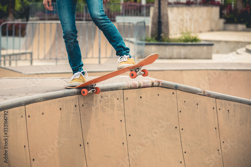 Photography Skateboarder skateboarding at skatepark ramp