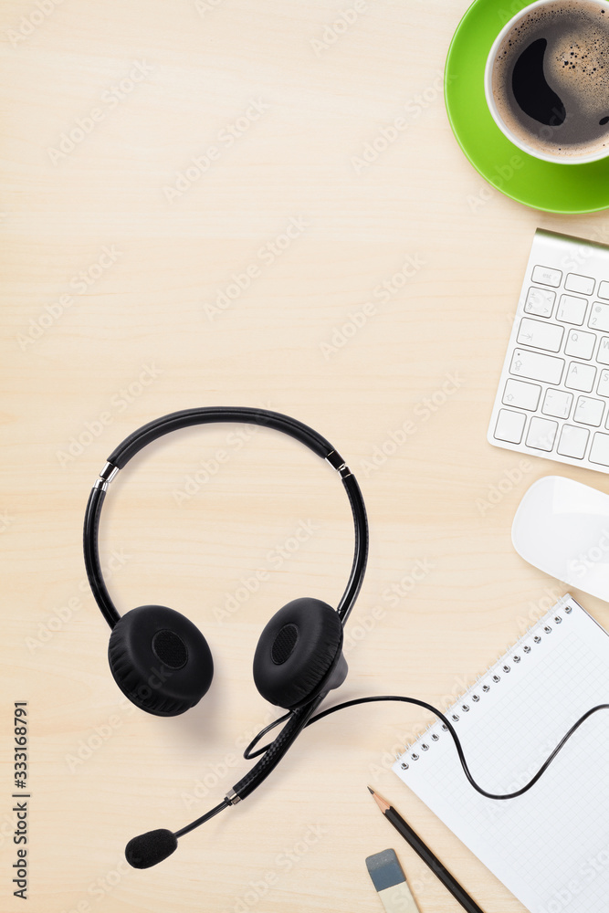 Office wooden backdrop with supplies and headset