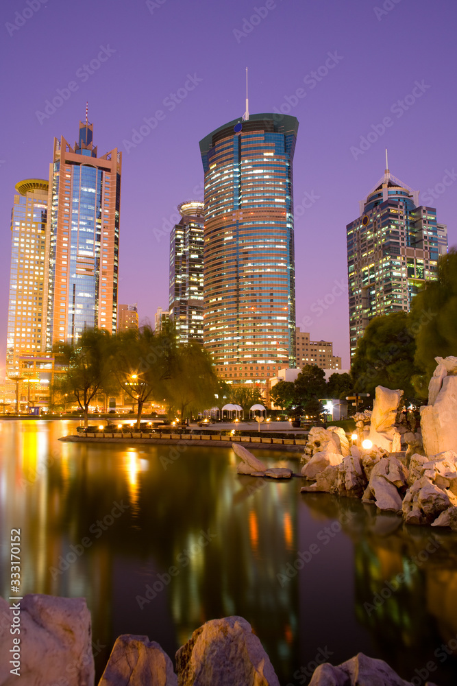Fototapeta premium Office buildings at Lujiazui financial district from Central Greenfield park in Pudong, Shanghai, China,