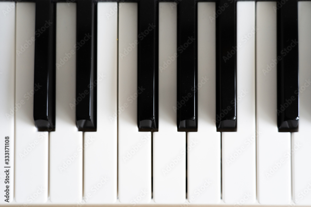 Black-and-white keys of a piano, top view Black-and-white keys of a piano, top view