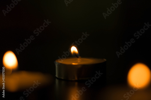 Candles that are lit in the dark