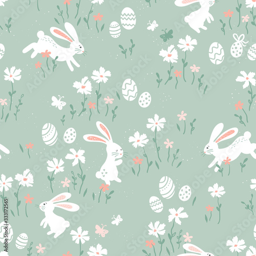 Cute hand drawn Easter seamless pattern with bunnies, Easter eggs and flowers. Great for Easter Cards, banner, wallpaper, textiles, wrapping- vector design