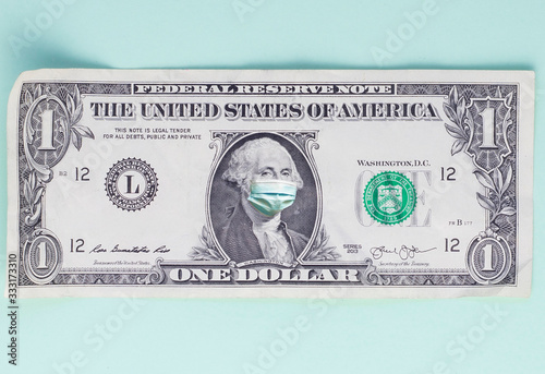 One dollar bill with medical mask photo