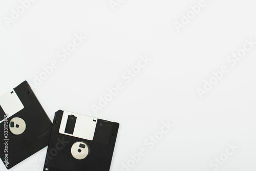 top view of two floppy disks on white background