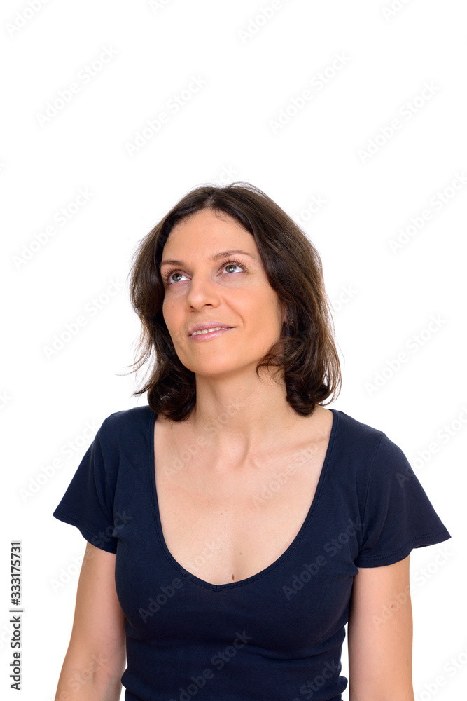 Studio shot of beautiful woman thinking isolated against white background Studio shot of beautiful woman thinking isolated against white background