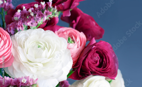 Pink, white and fuchsia flowers on a grey background