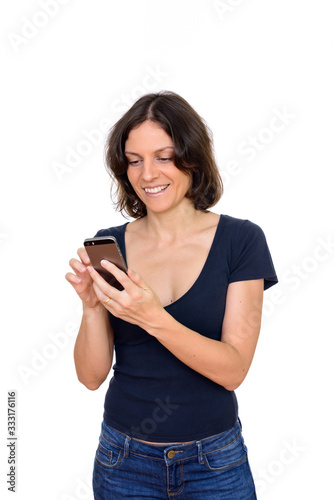 Studio shot of happy woman using mobile phone isolated against white background