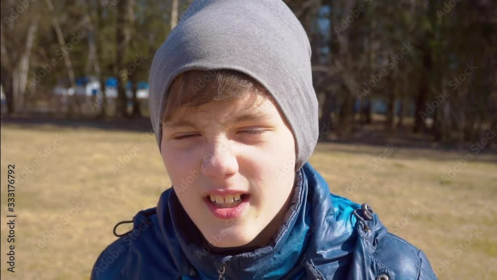 boy on a walk outdoors on a sunny day. boy on a walk outdoors on a sunny day.