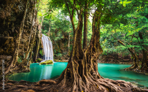 Fotografie, Tablou Beautiful nature scenic landscape Erawan waterfall in deep tropical jungle rain