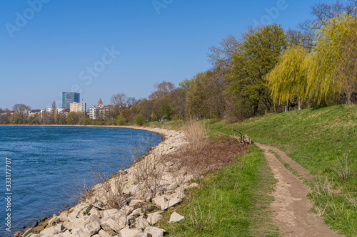 The forest park in Mannheim located directly on the Rhine during the corona isolation with few walkers on 25.03.2020 © Yannick