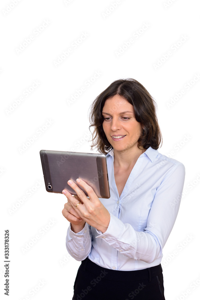 Studio shot of happy woman using digital tablet isolated against white background Studio shot of happy woman using digital tablet isolated against white background
