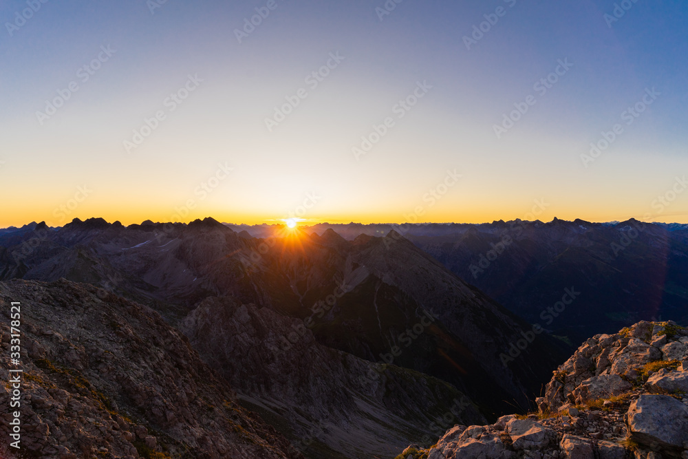 Sunrise on top of the mountains between Austria and Germany