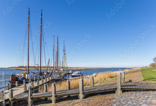 Sailing ships at the jetty in historic village Makkum  Netherlands