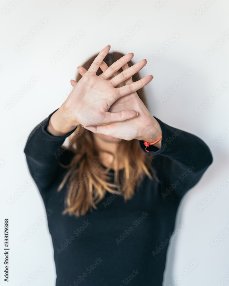 Women's hands as a signal to stop or refuse. Concept of stopping violence or abuse against women. Women's hands as a signal to stop or refuse. Concept of stopping violence or abuse against women.