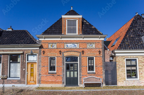Historic red brick house in the Frisian village Makkum, Netherlands